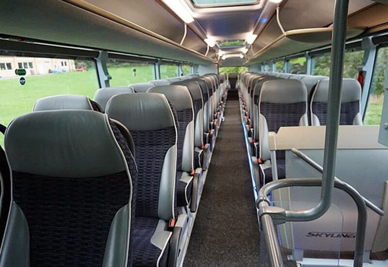 Neoplan Skyliner cabin with grey seats and a centre aisle